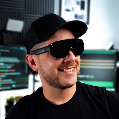 Dilmer Valecillos wearing smart glasses in his XR studio